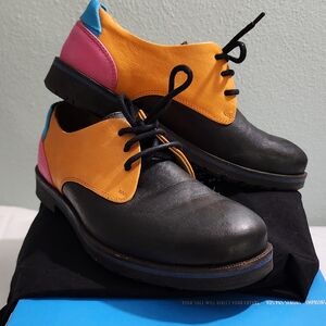 John Fluevog Orange and Black Flats with Unique Design